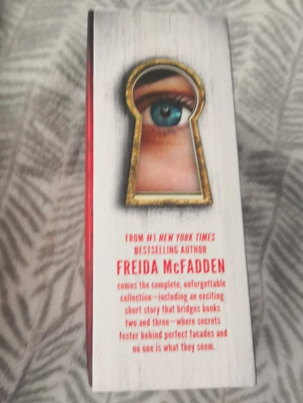 Designed edges that spell ENTER THE TWISTED WORLD OF THE HOUSEMAID when the book